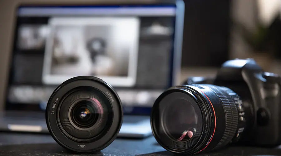 Digital camera lenses displayed for resale evaluation at PayMore Doraville
